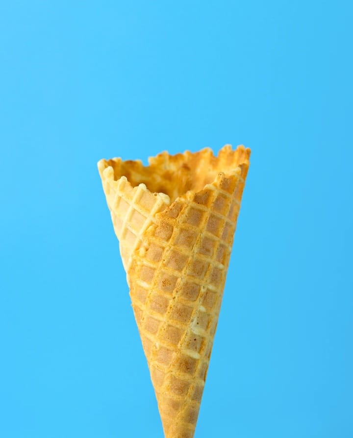 Picture of an ice cream cone on a blue background